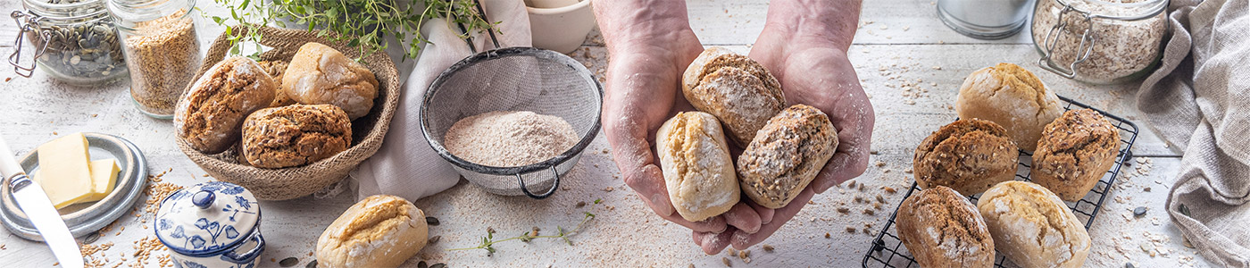 A selection of different Penny Loaves held in a hand