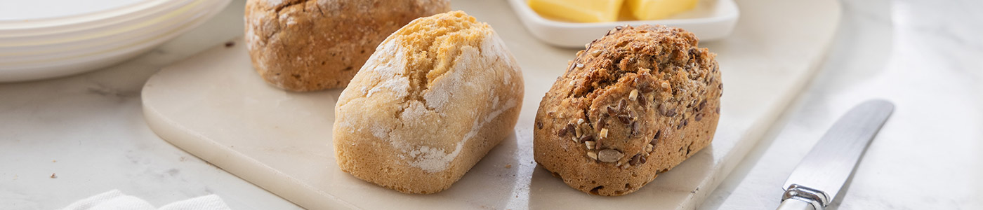 A bread board containing a selection of Penny Loaves