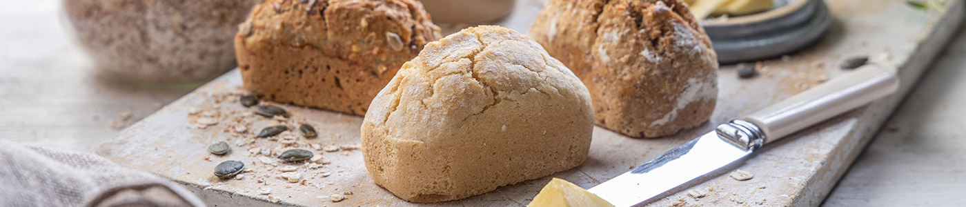 A bread board containing a selection of Penny Loaves