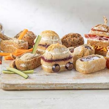 A bread board full of Penny Loaf sandwiches