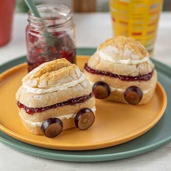 White Penny Loaves sliced and filled with ham and cream cheese