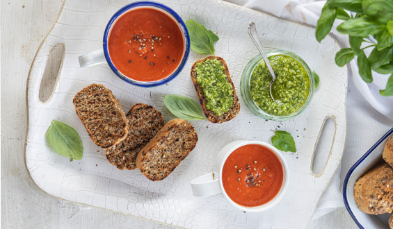 Roasted pepper soup with penny loaves spread with pesto