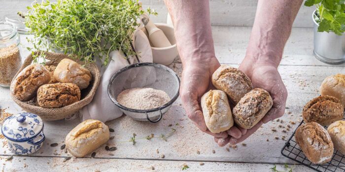 Cupped hand holding a selection of penny loaves