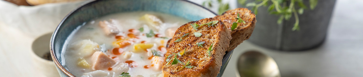 Soup with brown Penny Loaves on the side